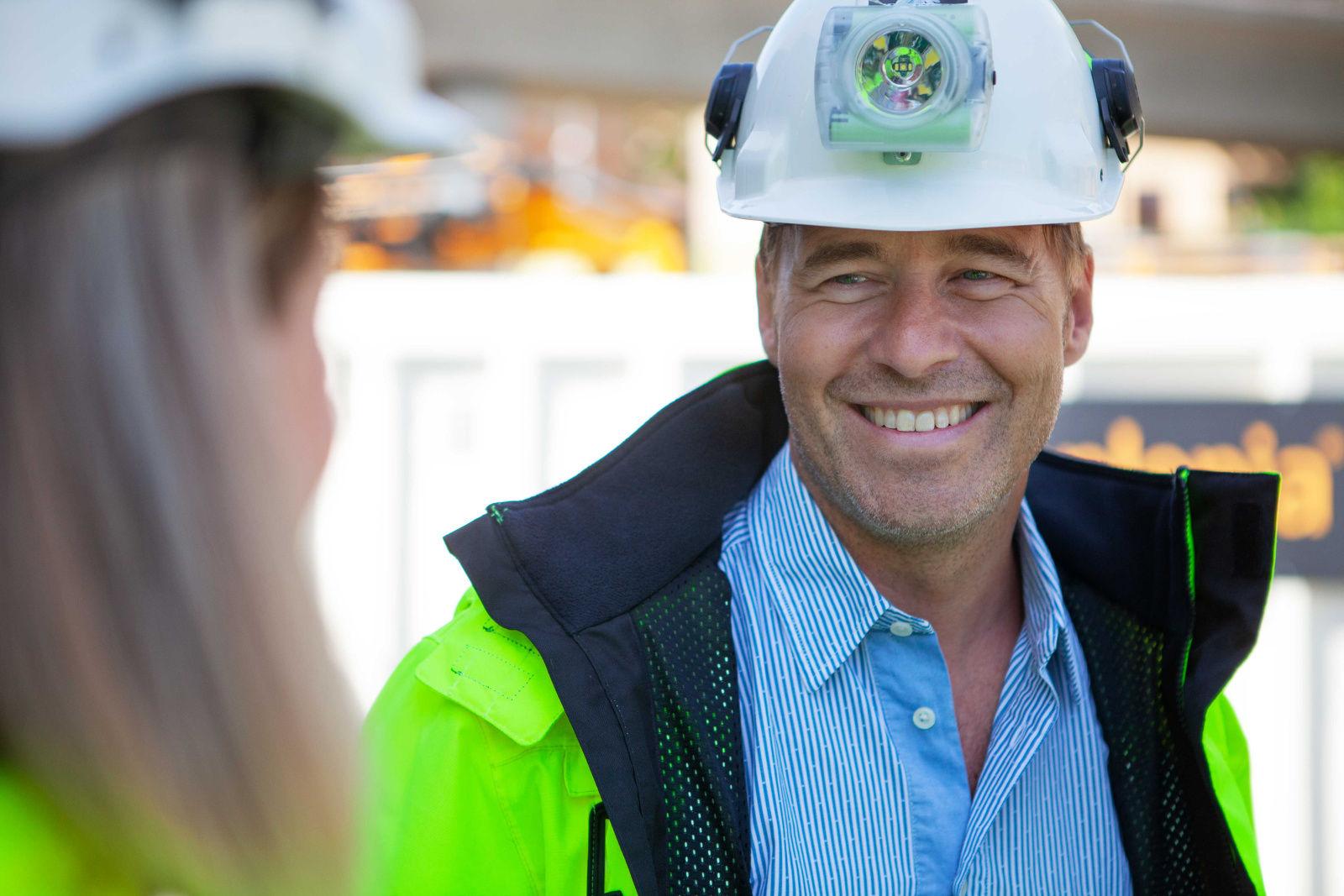 A man in a hardhat on construction site