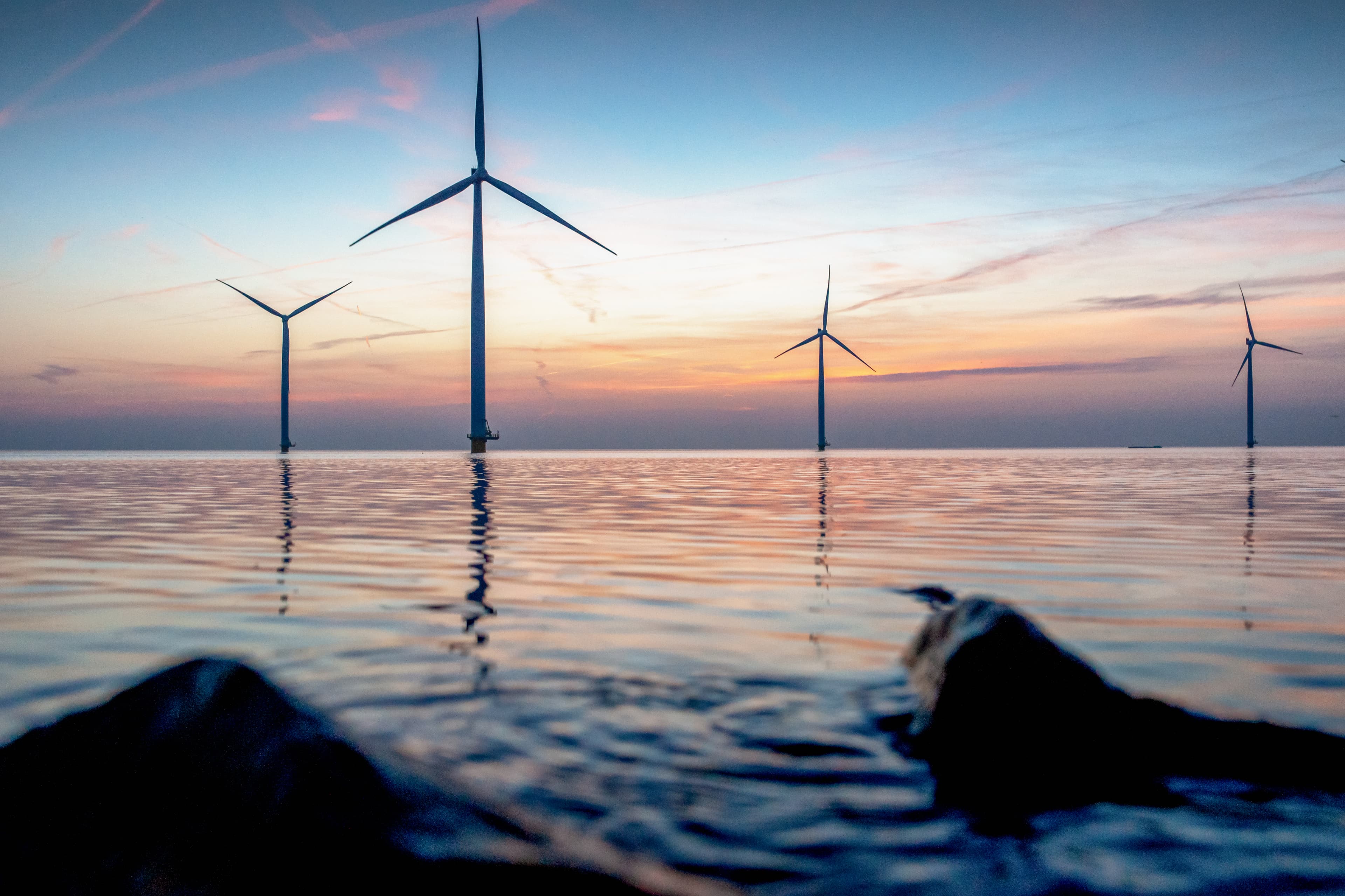 Photo of windmills on a sea