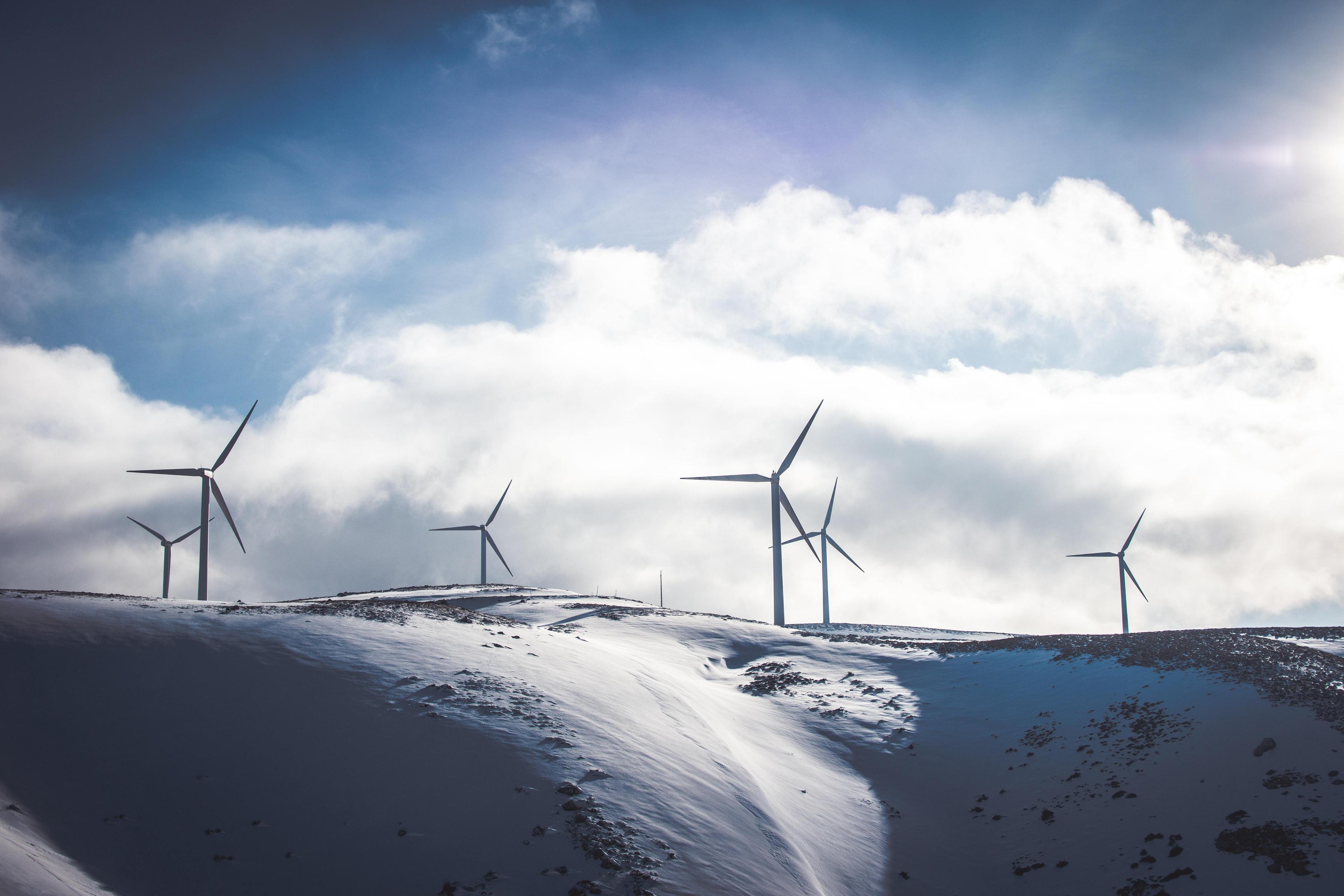 Windmills on mountain with snow