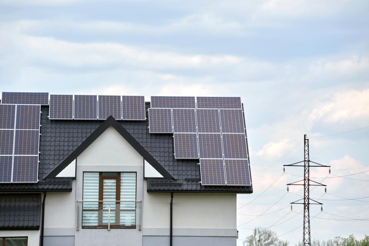 House with roof covered in solar panels