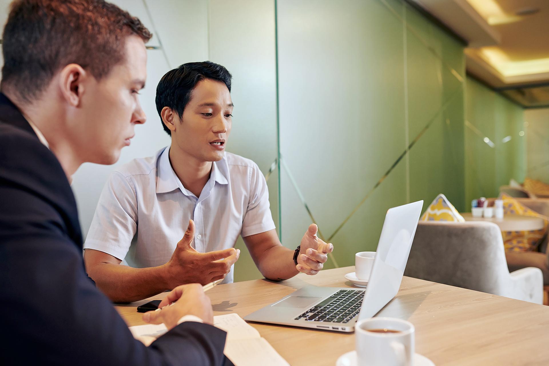 Image of Two students sitting in front of the laptop to represent Volue master dissertation