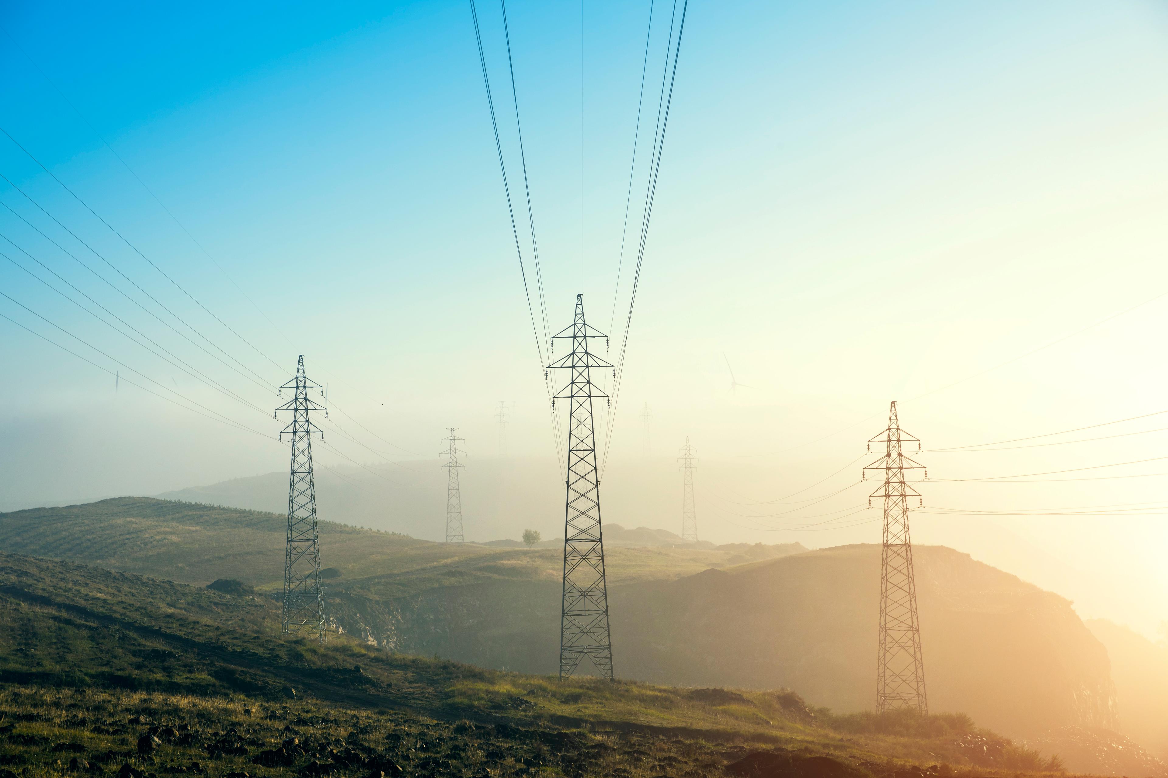 Pylons on a hill with a sunset background