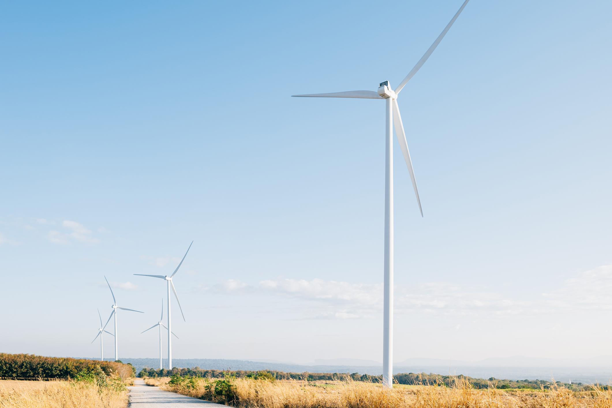 Windmills on an open field.