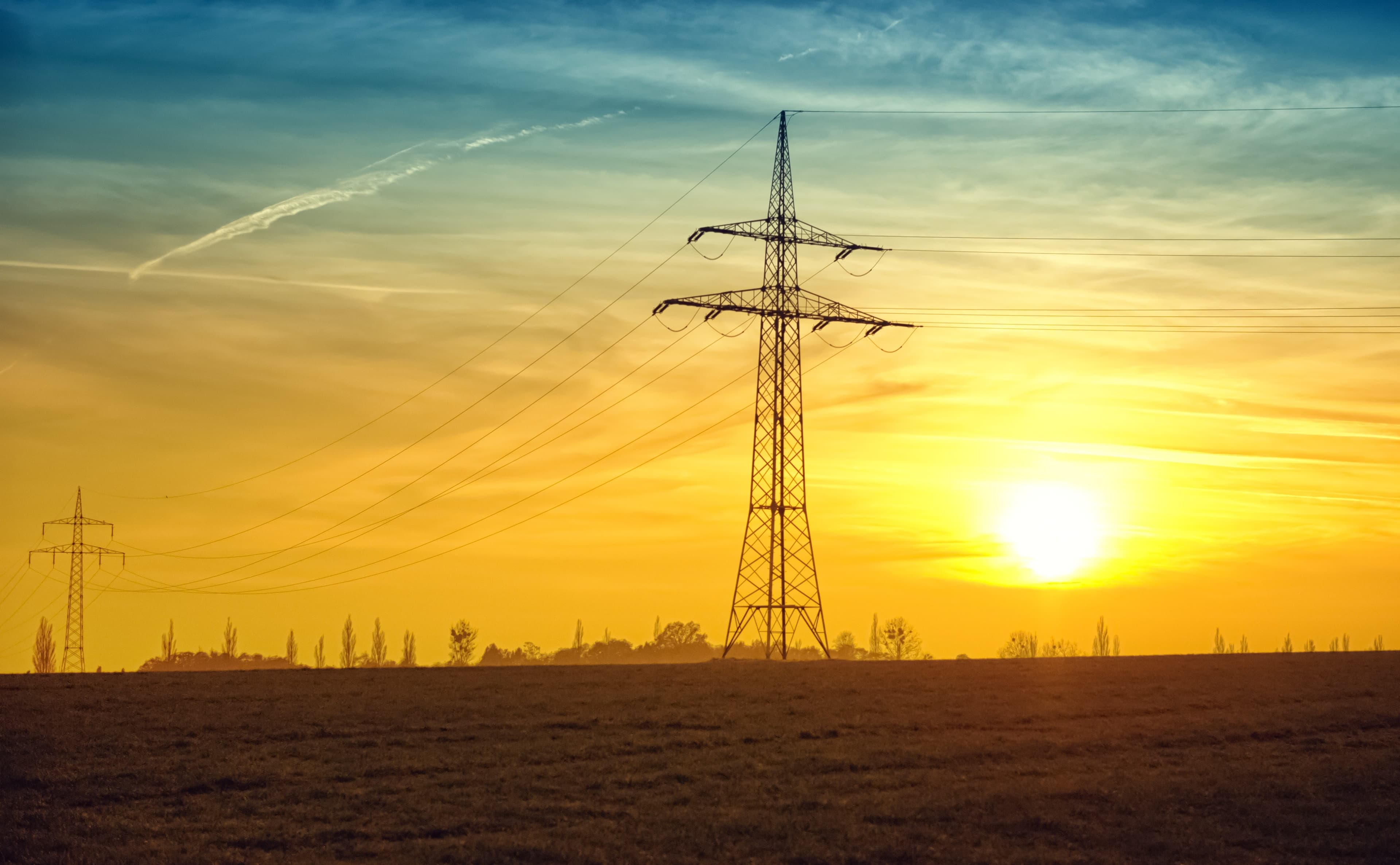 Power masts in sunset