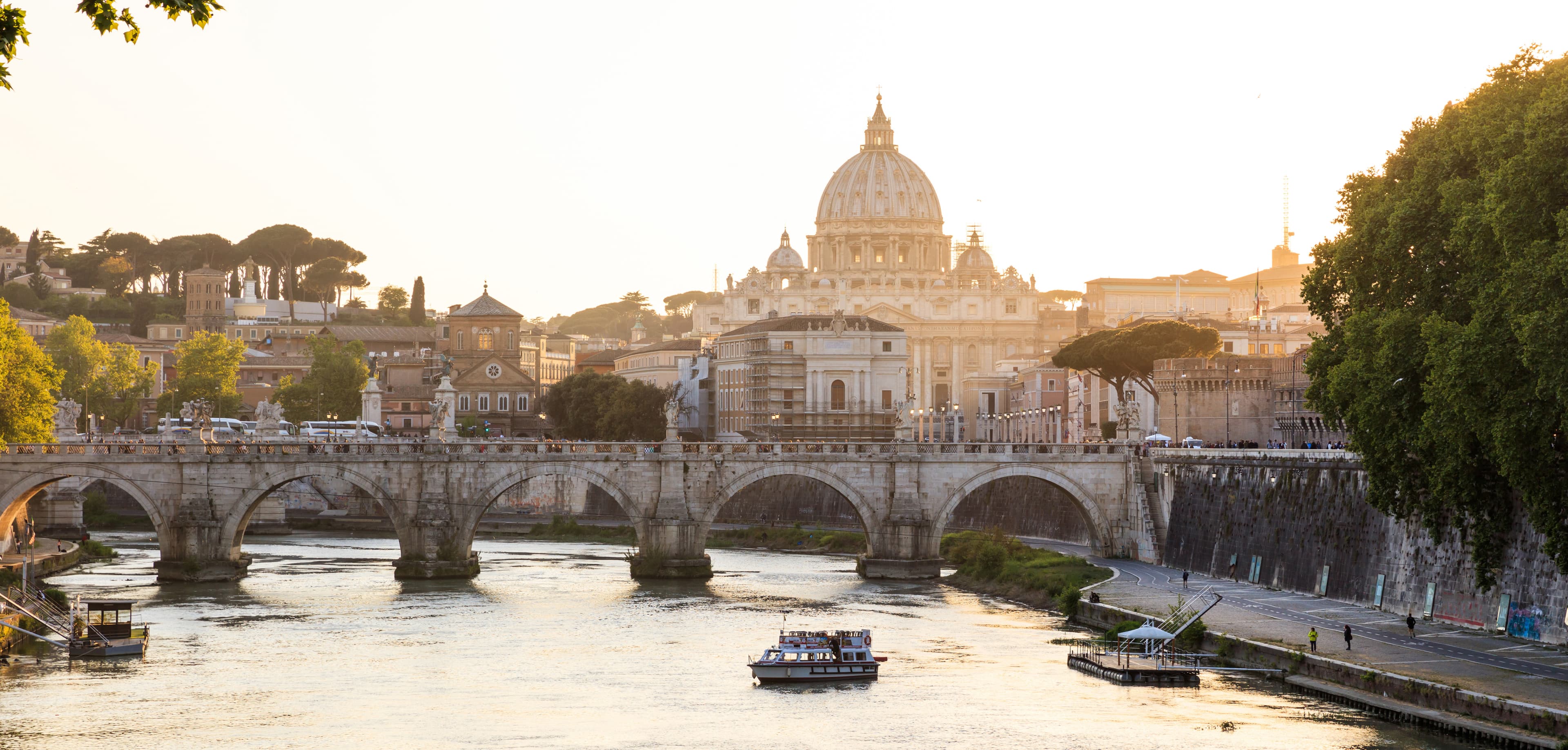 Photo of a bridge with an Italian city in the background
