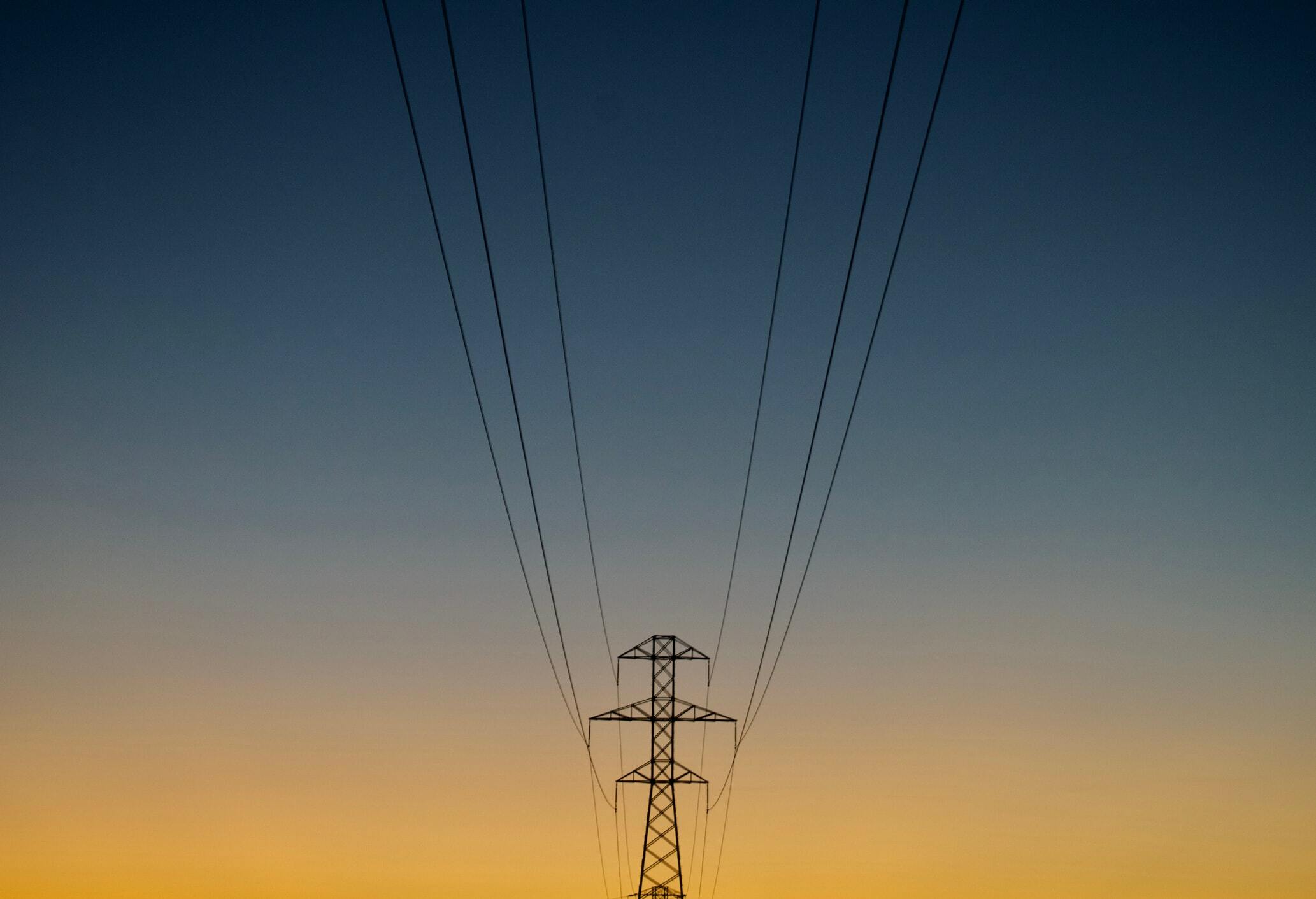 Power gird poles at sunset