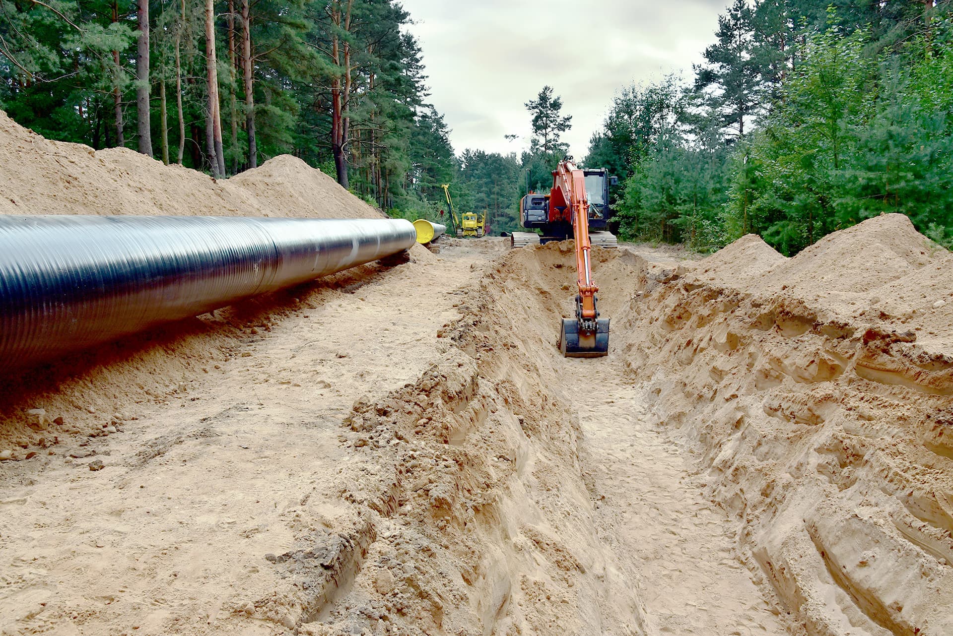 Image of an excavator in the filed to represent WS and Trench - Module